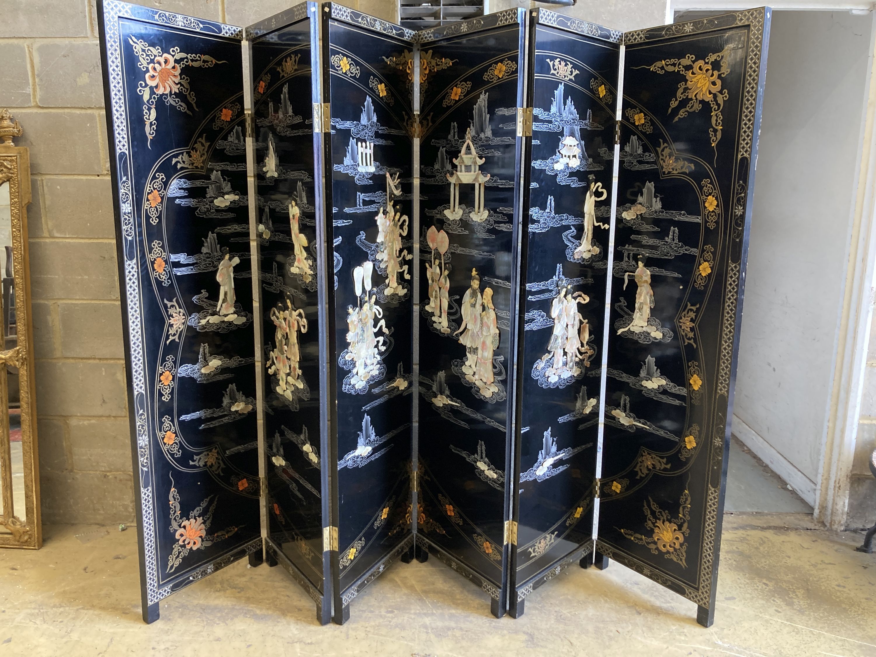 A 1920's - 30s Chinese inlaid mother of pearl six fold screen, each panel 45cm wide, height 183cm 72 x 95ins